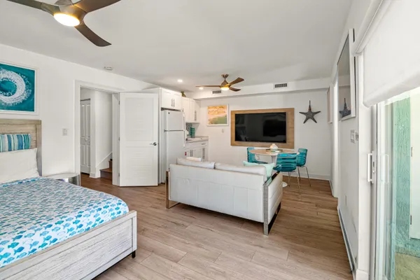 a kitchen with stainless steel appliances granite countertop a stove top oven a sink and cabinets