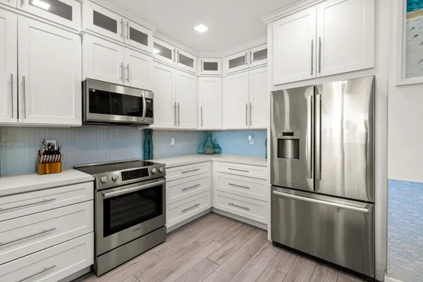 a white toilet sitting next to a shower