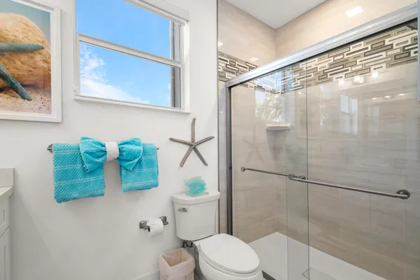 a bathroom with a bathtub and shower