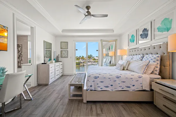 a view of a house with swimming pool and sitting area