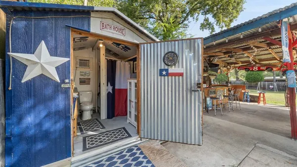 a view of a wooden door of the house