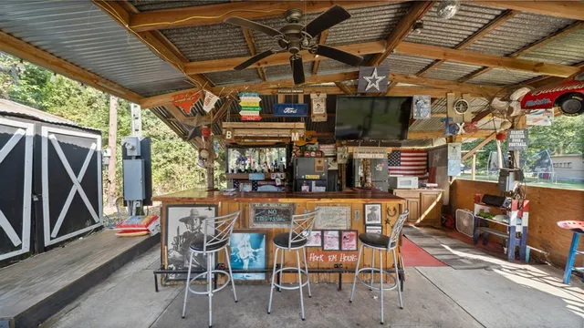 a view of a chairs and table in a patio