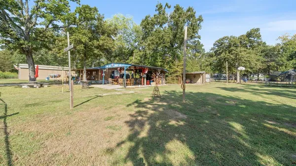 a view of a park with swings and slides