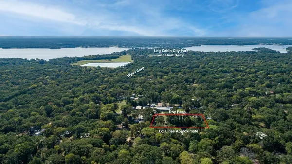 an aerial view of a houses with city view