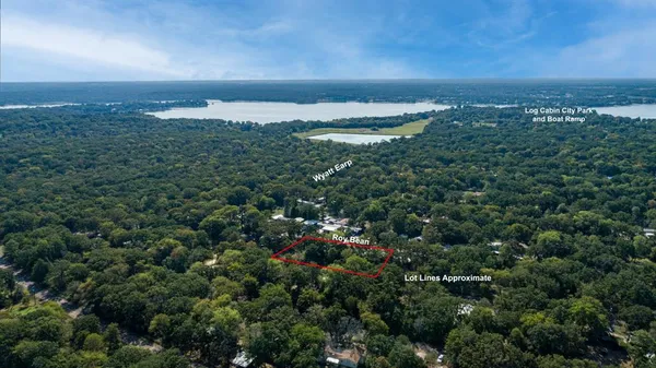 an aerial view of residential building and trees around