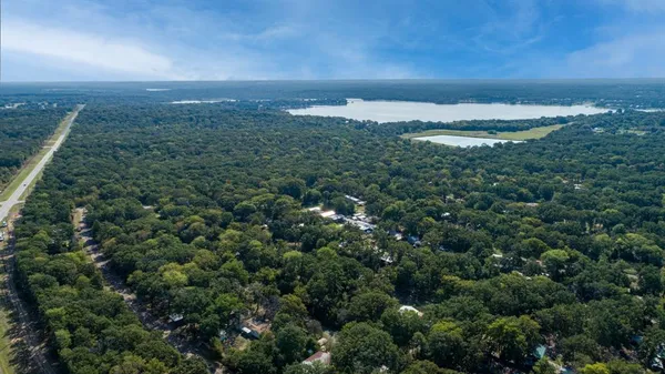 an aerial view of residential building and trees around