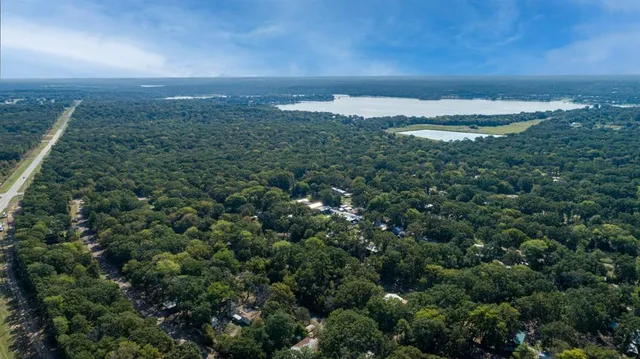 an aerial view of residential building and trees around