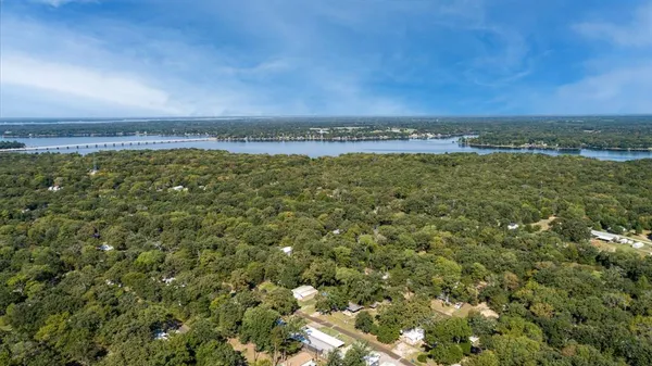 a view of a field with an ocean