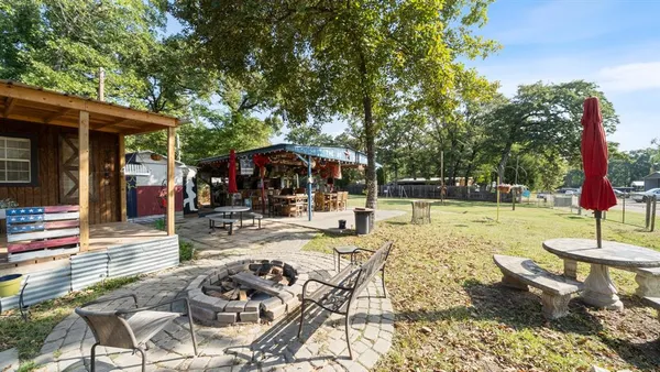 a view of a swimming pool with chairs and tables