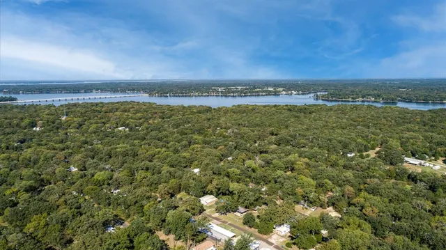 a view of a field with an ocean