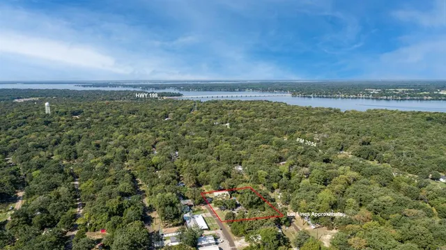 an aerial view of a residential houses with outdoor space and garden view