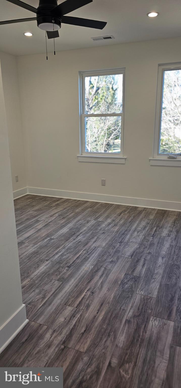 1427 Ocean Pleasantville, NJ 08232 - Photo 14 of 27 an empty room with wooden floor and windows