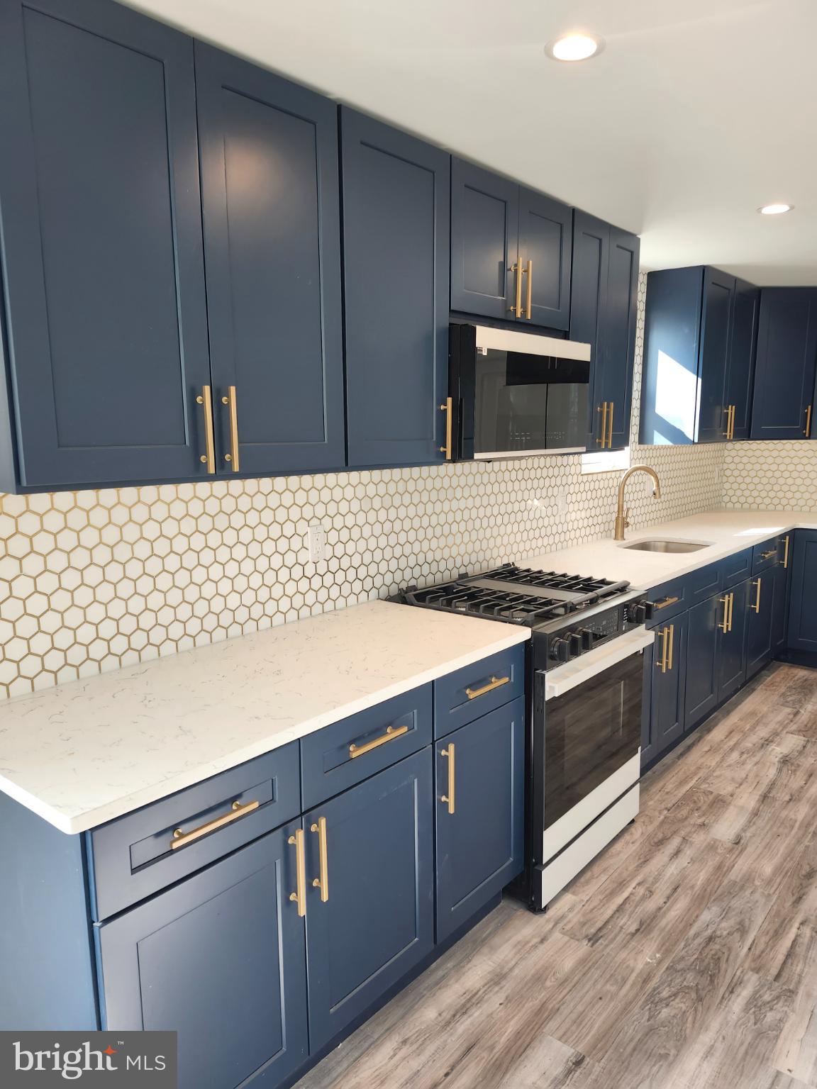 1427 Ocean Pleasantville, NJ 08232 - Photo 7 of 27 a kitchen with granite countertop wooden cabinets and stainless steel appliances