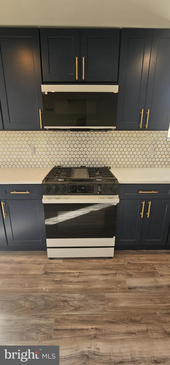 1427 Ocean Pleasantville, NJ 08232 - Photo 8 of 27 a stove top oven sitting inside of a kitchen