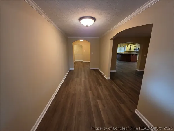 wooden floor in a hall with a window
