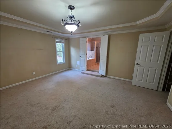 a view of empty room with windows