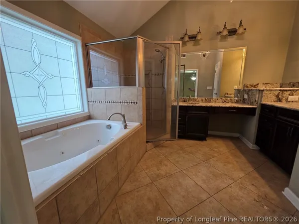 a bathroom with a bathtub and a sink