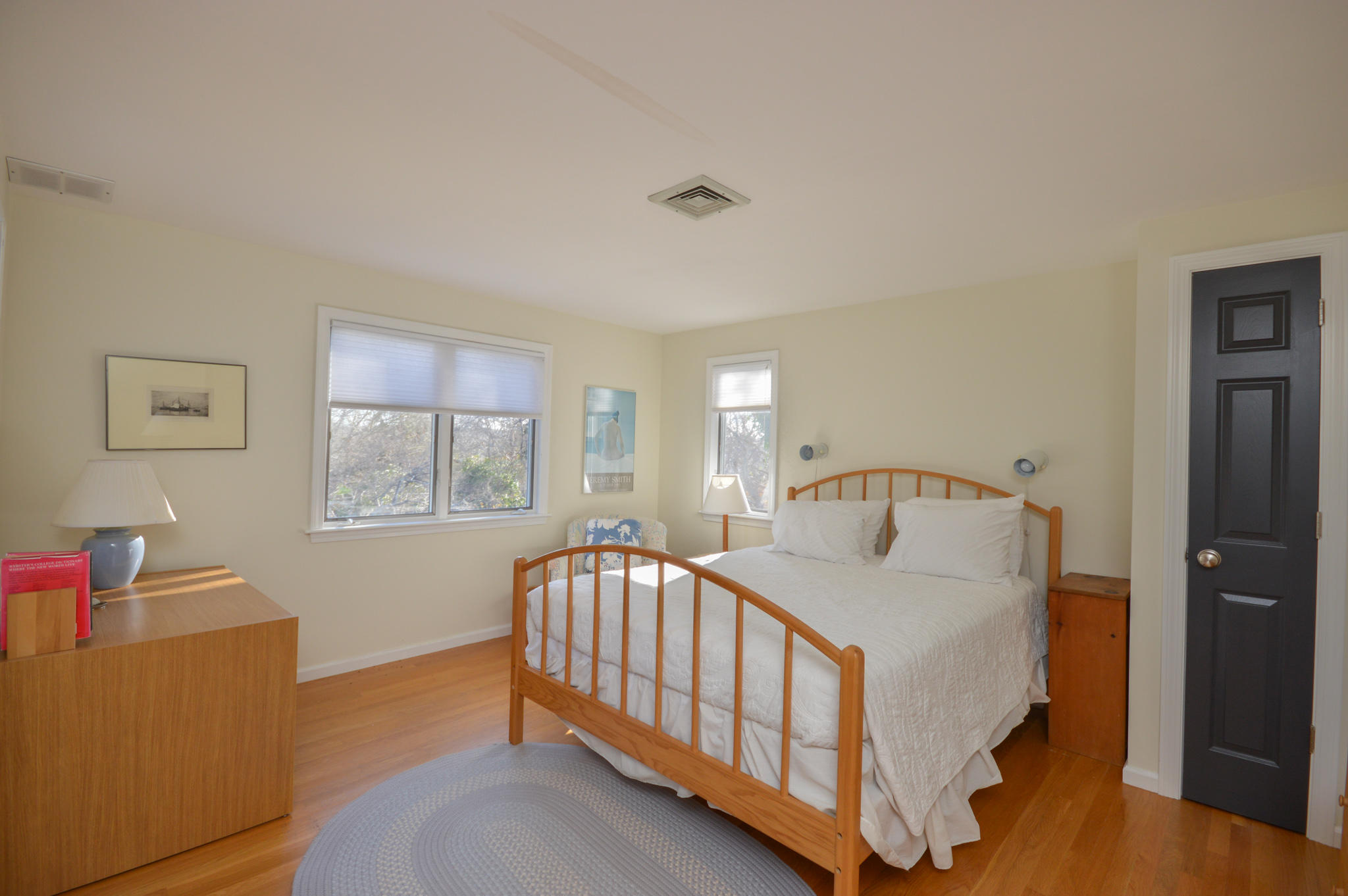70 Indian Ridge Road Falmouth, MA 02540 - Photo 27 of 38 a bedroom with a bed and a table in it