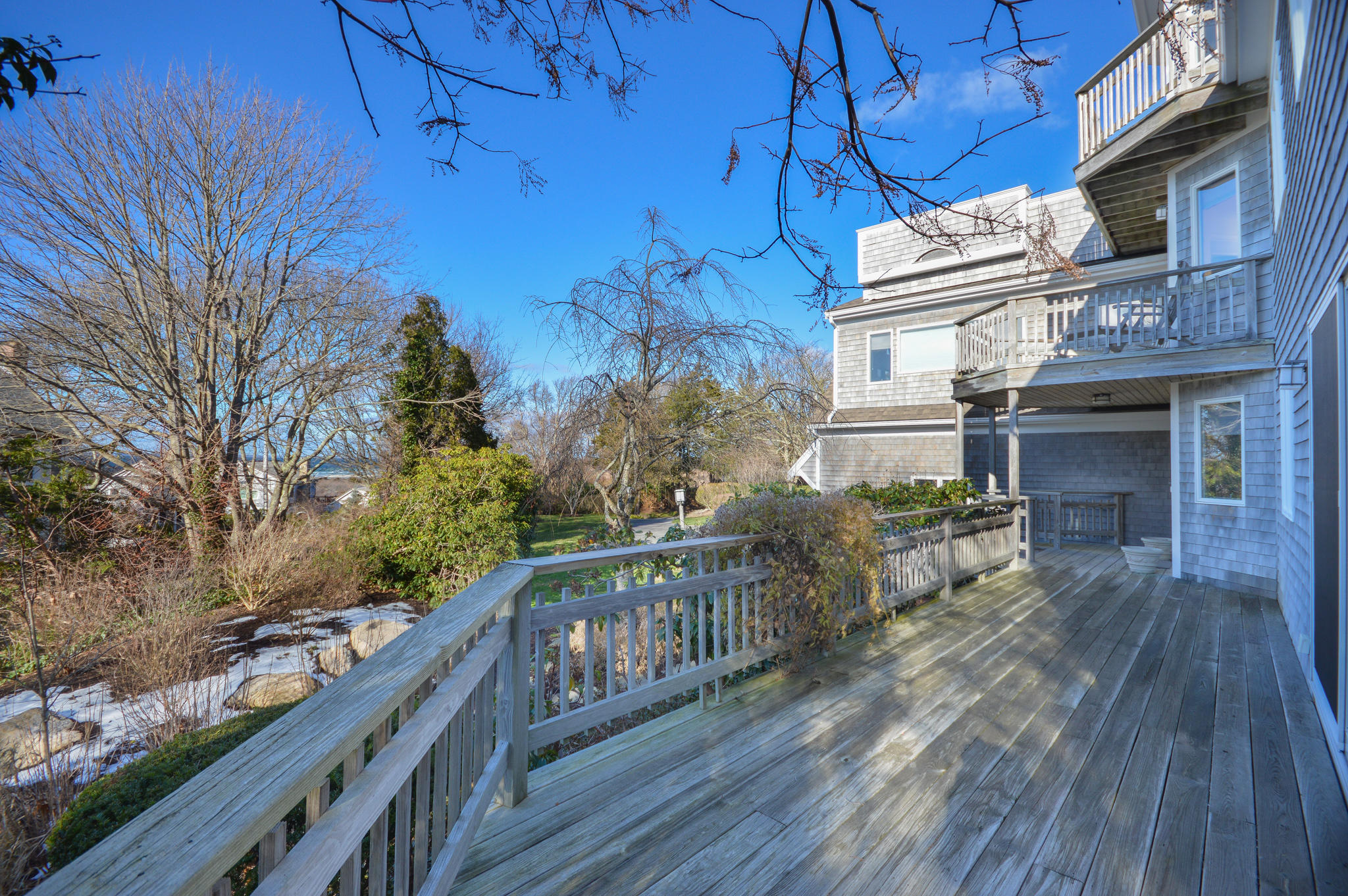 70 Indian Ridge Road Falmouth, MA 02540 - Photo 33 of 38 a balcony with wooden floor and fence