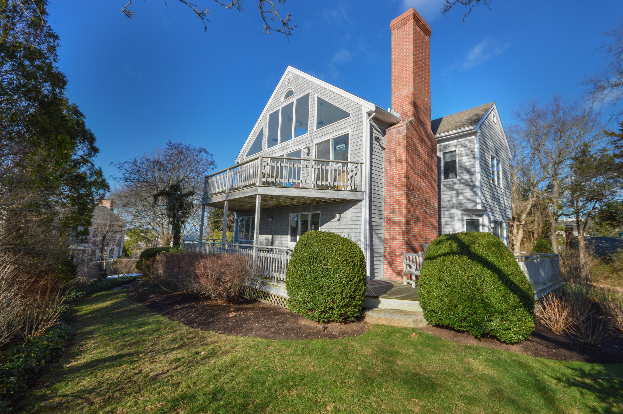 70 Indian Ridge Road Falmouth, MA 02540 - Photo 6 of 38 a view of a house with a yard and plants