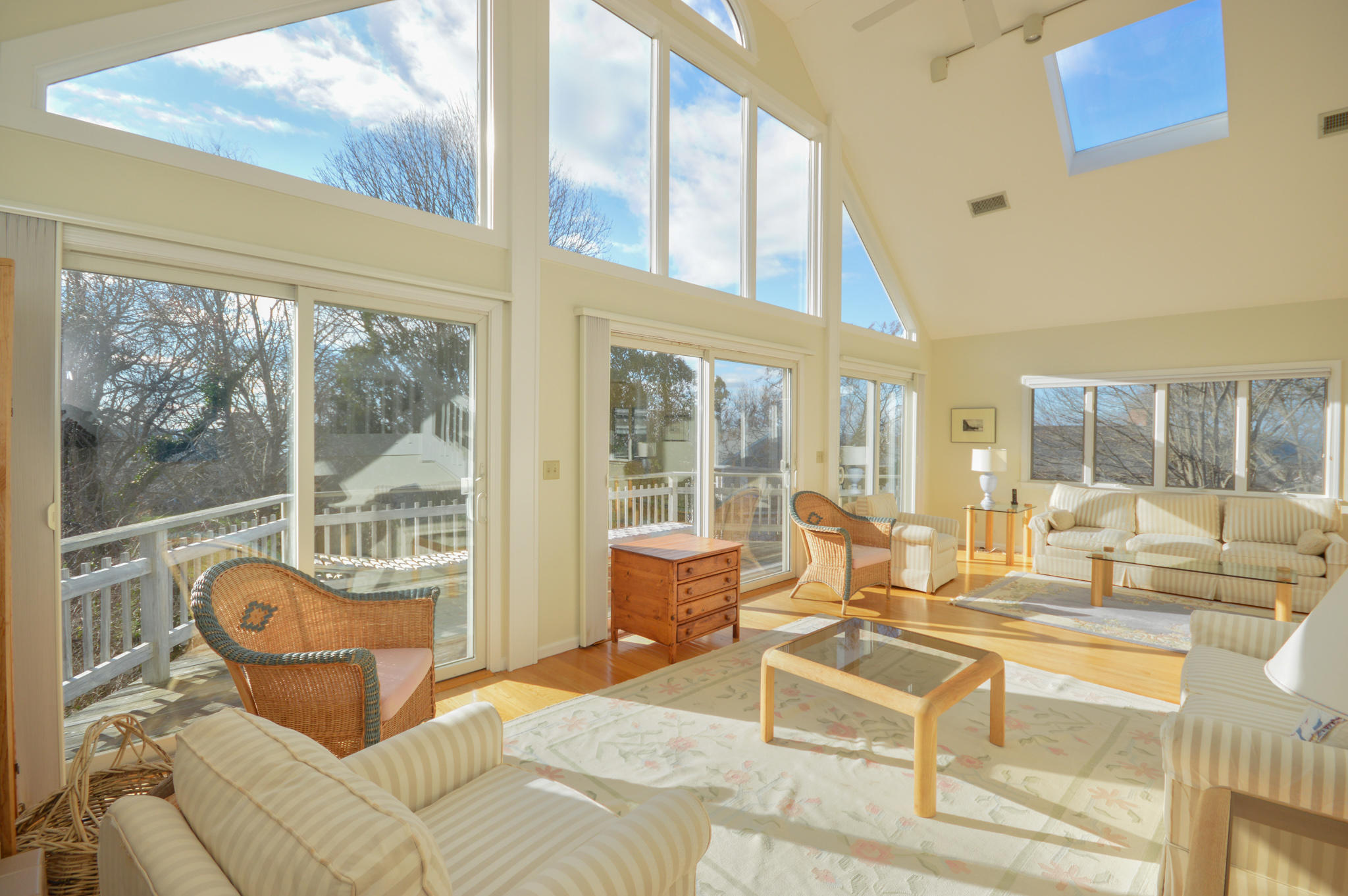 70 Indian Ridge Road Falmouth, MA 02540 - Photo 9 of 38 a living room with furniture and a floor to ceiling window