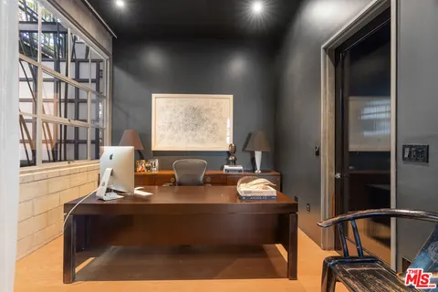 a couple of potted plants in front of door