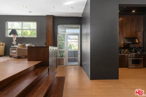 a kitchen with stainless steel appliances a stove and a refrigerator