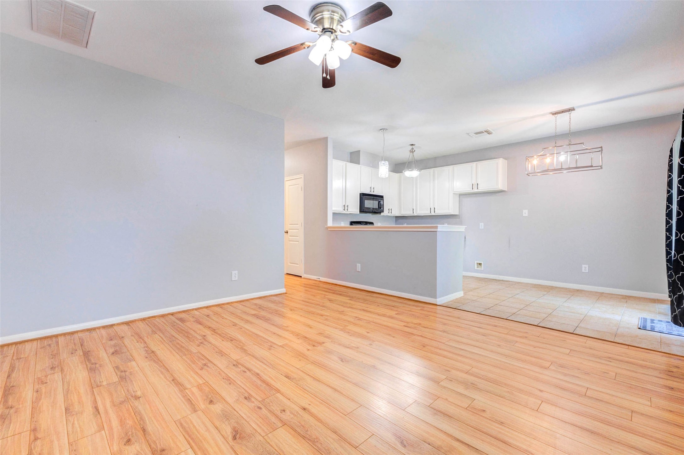 14522 Durham Chase Lane Houston, TX 77095 - Photo 9 of 40 a view of a kitchen with a dishwasher cabinets and wooden floor