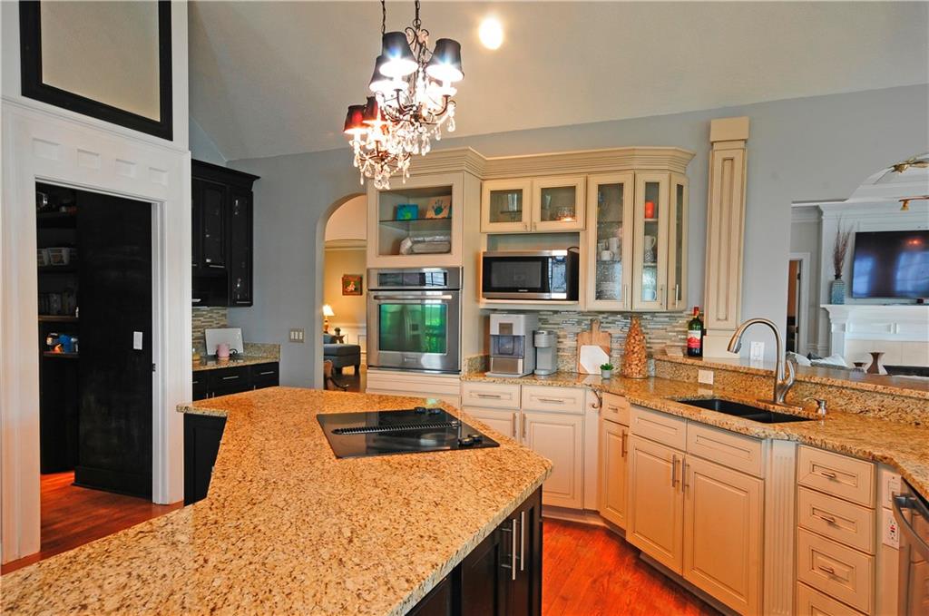 10121 Lakeview Parkway Villa Rica, GA 30180 - Photo 11 of 55 a kitchen with stainless steel appliances granite countertop a sink stove and refrigerator