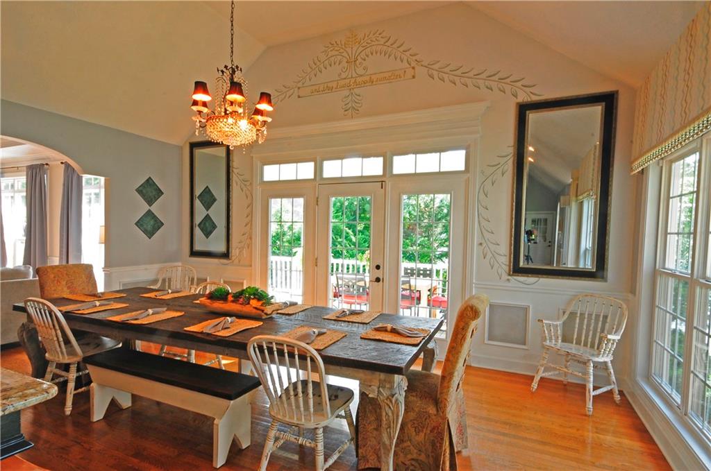 10121 Lakeview Parkway Villa Rica, GA 30180 - Photo 16 of 55 a view of a dining room with furniture a chandelier and wooden floor