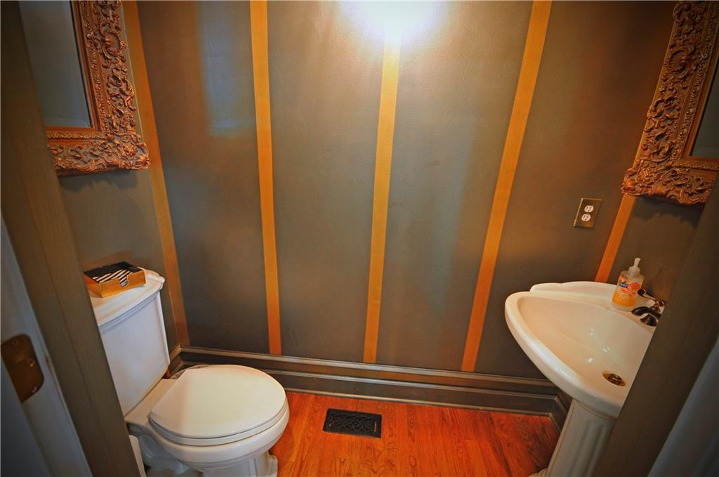 10121 Lakeview Parkway Villa Rica, GA 30180 - Photo 18 of 55 a bathroom with a toilet a sink and mirror