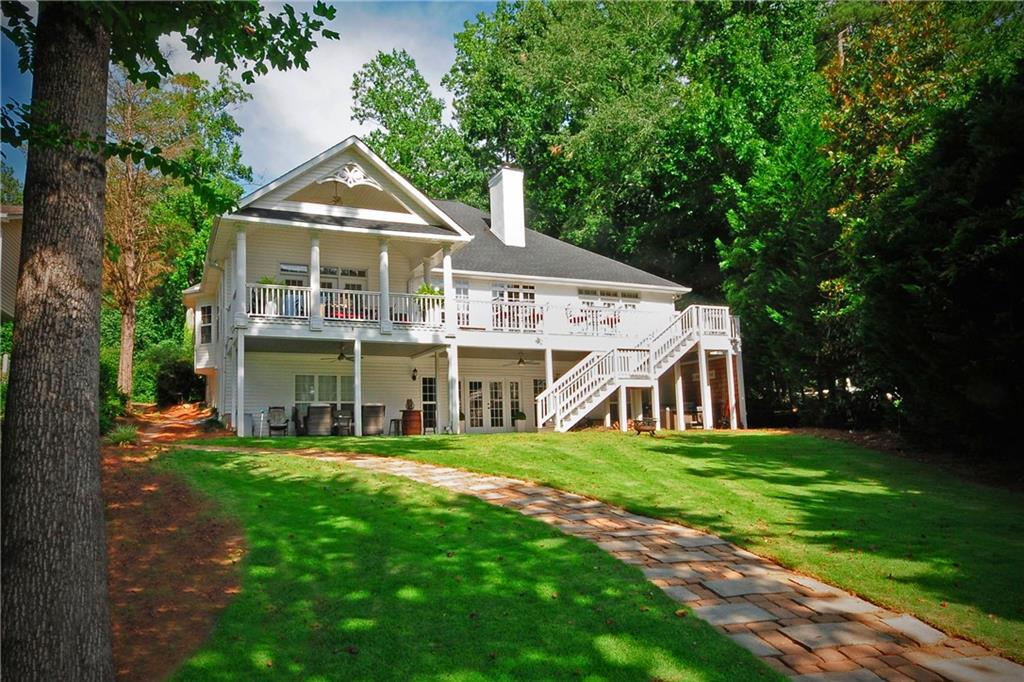 10121 Lakeview Parkway Villa Rica, GA 30180 - Photo 2 of 55 a view of a house with a big yard and large trees