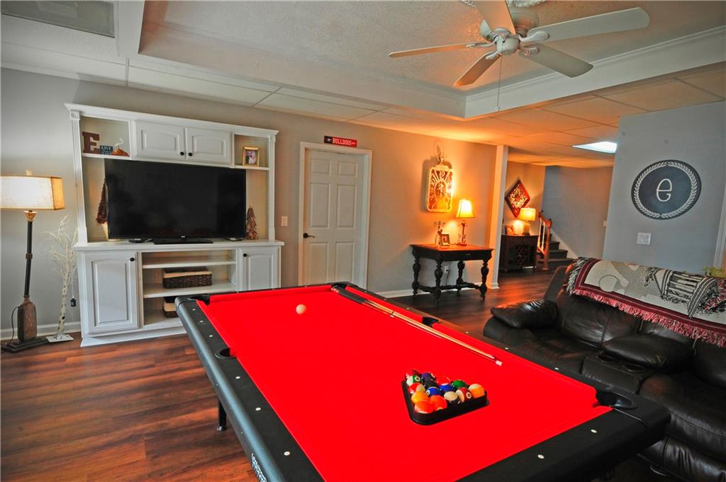 10121 Lakeview Parkway Villa Rica, GA 30180 - Photo 29 of 55 a living room with furniture pool table flat screen tv and a couch