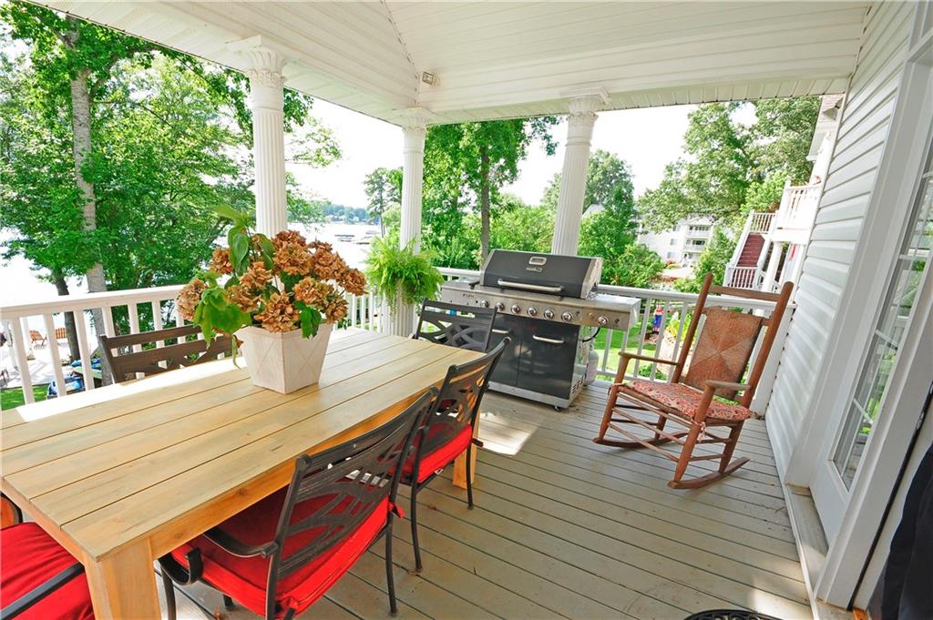 10121 Lakeview Parkway Villa Rica, GA 30180 - Photo 37 of 55 a outdoor dining space with furniture and wooden floor