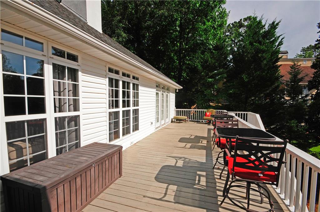 10121 Lakeview Parkway Villa Rica, GA 30180 - Photo 39 of 55 a view of a deck with wooden floor and roof with a garden view