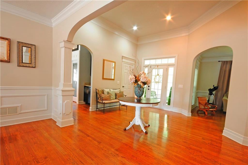 10121 Lakeview Parkway Villa Rica, GA 30180 - Photo 5 of 55 a living room with furniture a wooden floor and a tub