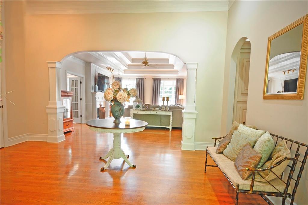 10121 Lakeview Parkway Villa Rica, GA 30180 - Photo 6 of 55 a living room with fireplace furniture and a chandelier