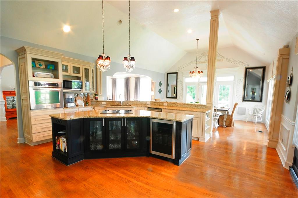 10121 Lakeview Parkway Villa Rica, GA 30180 - Photo 10 of 55 a kitchen with stainless steel appliances granite countertop a stove and a view of living room