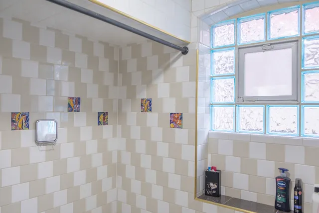 a view of a hallway with wooden shelves