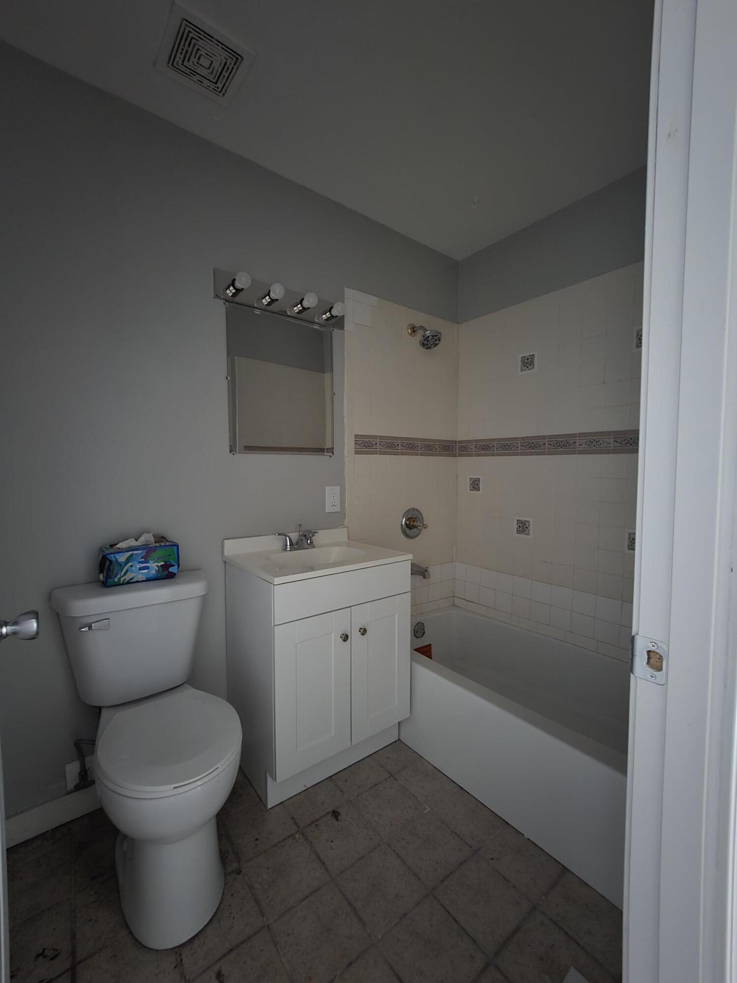 1044 Hobart Street Gary, IN 46406 - Photo 14 of 22 a bathroom with a toilet sink and shower