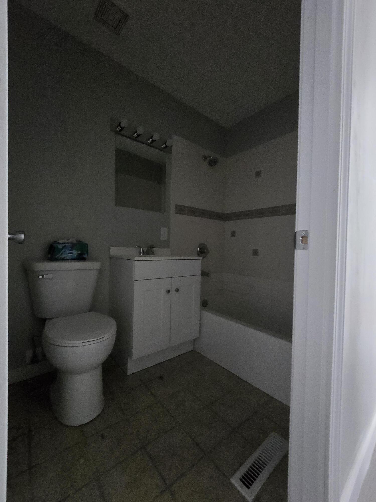 1044 Hobart Street Gary, IN 46406 - Photo 15 of 22 a bathroom with a toilet a sink and a bathtub