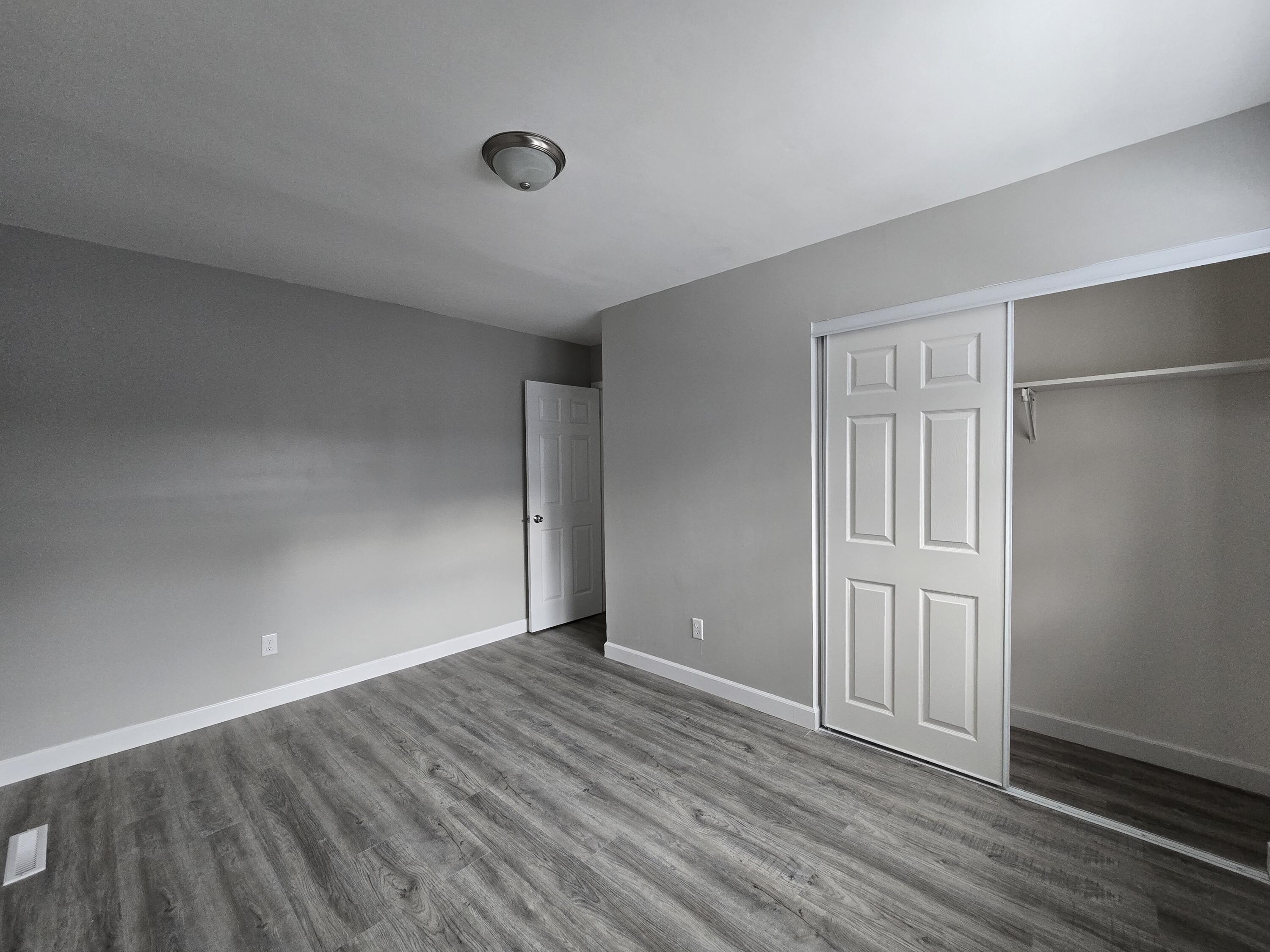 1044 Hobart Street Gary, IN 46406 - Photo 20 of 22 a view of an empty room with wooden floor
