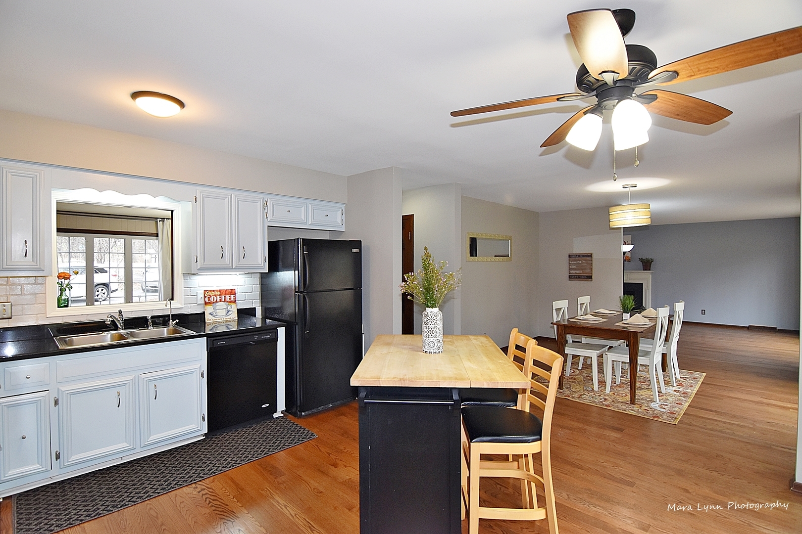 37-w473 Crane Road St. Charles, IL 60175 - Photo 14 of 37 a kitchen with stainless steel appliances granite countertop a dining table chairs refrigerator and cabinets
