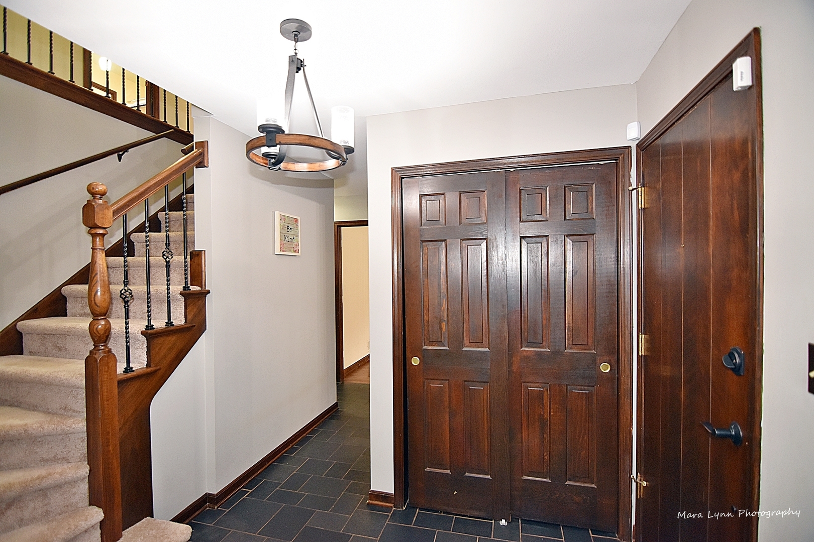37-w473 Crane Road St. Charles, IL 60175 - Photo 3 of 37 a view of a hallway with wooden floor and staircase