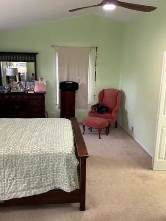a bedroom with a bed and furniture