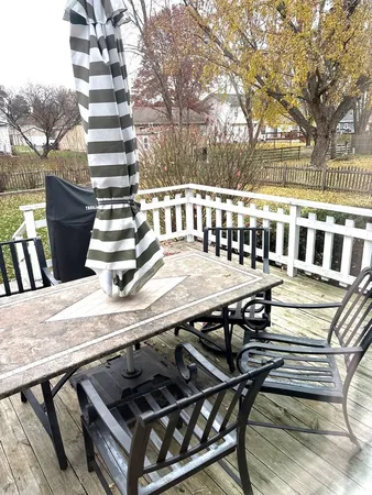 a view of a chairs and tables on the deck
