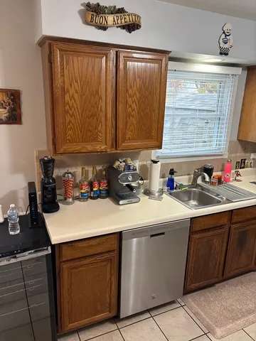 a kitchen with a sink and cabinets