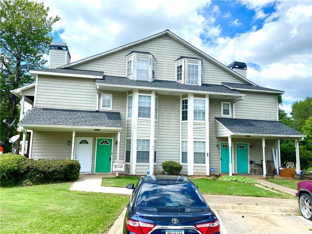 9474 Cypress Lane Jonesboro, GA 30238 - Photo 1 of 1 a front view of a house with a yard