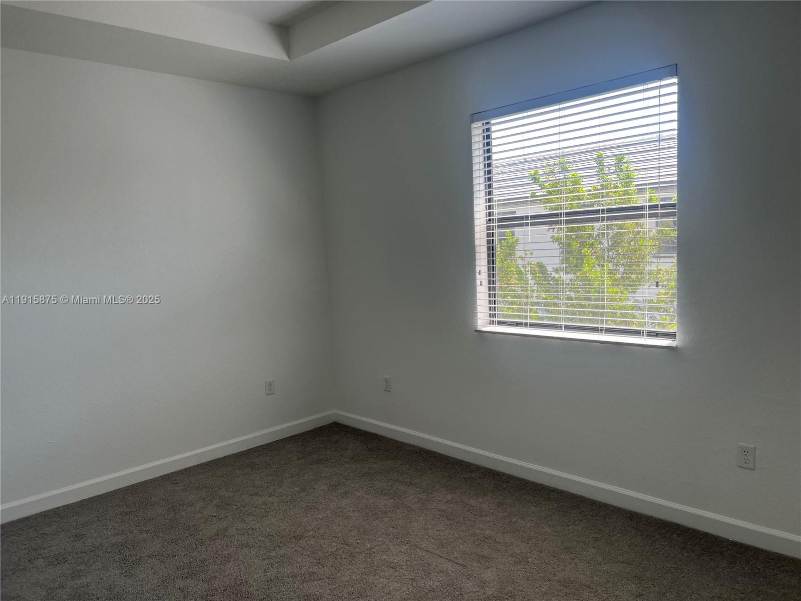 28701 Southwest 132nd Place Homestead, FL 33033 - Photo 12 of 17 an empty room with a window