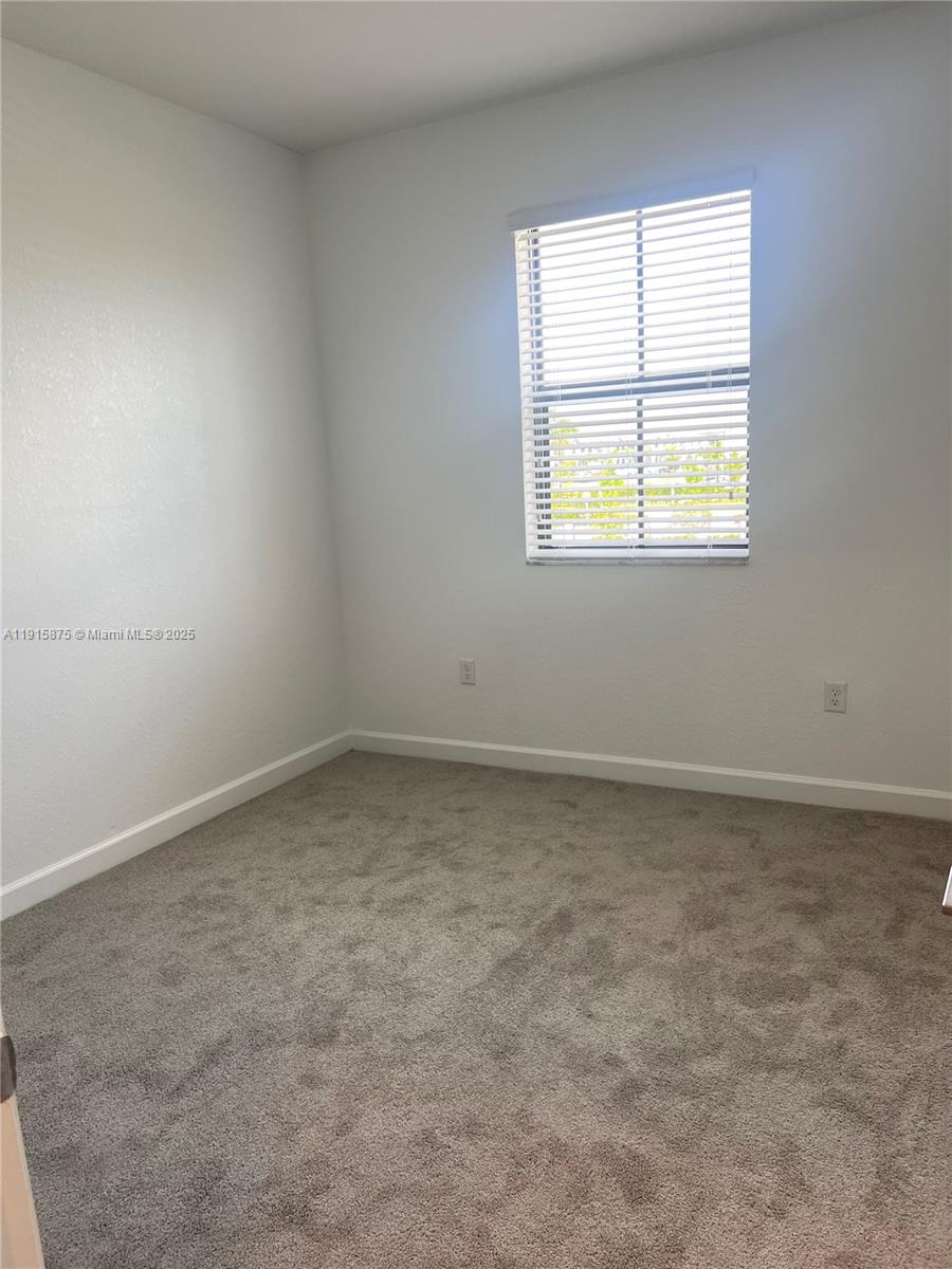 28701 Southwest 132nd Place Homestead, FL 33033 - Photo 13 of 17 an empty room with a window